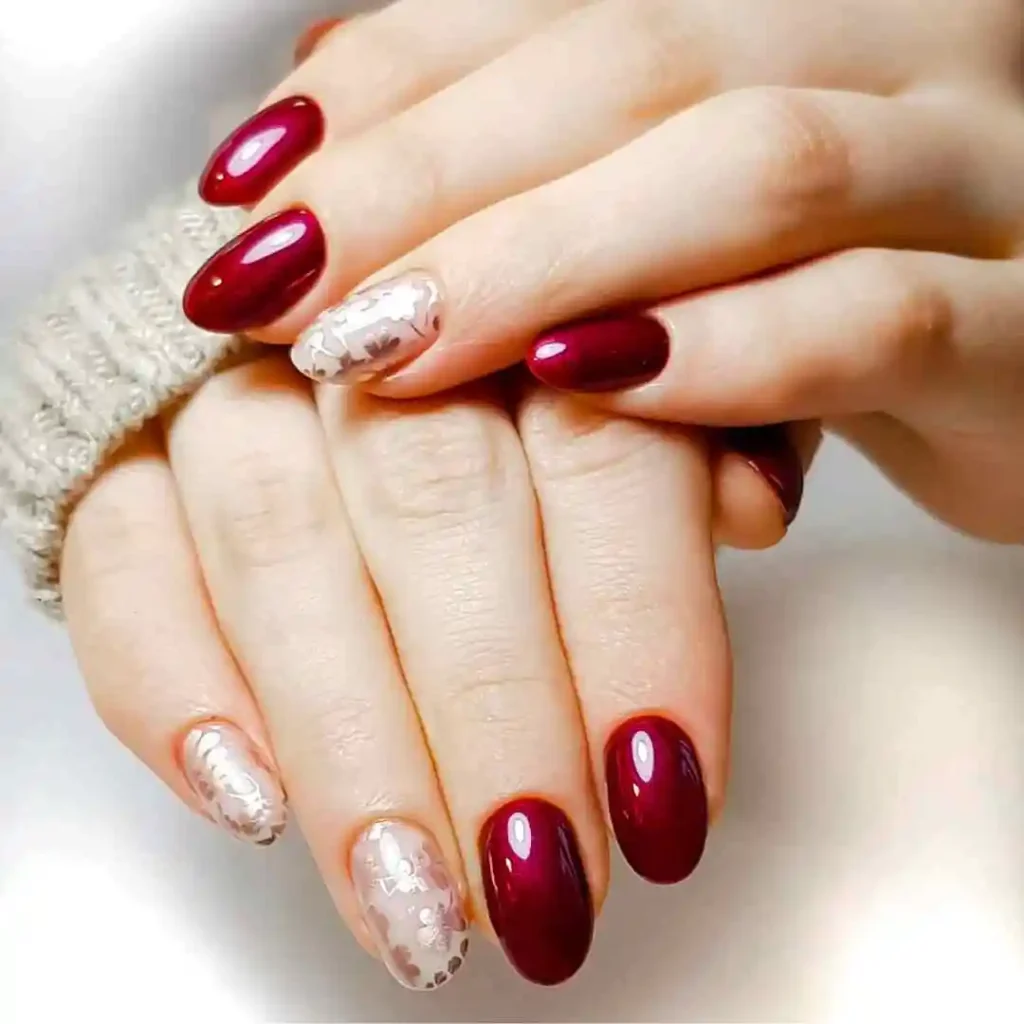 a close up of a red almond nails design